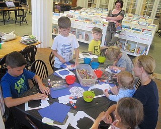 Neighbors | Zack Shively.Children created an autumn themed craft following story time at Poland Library's Listen and Craft event. Librarian Amanda Koller gave the children a couple different crafts to choose from.