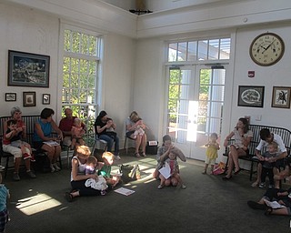 Neighbors | Zack Shively.Parents and babies sang "Itsy Bitsy Spider," complete with hand motions, on Sept. 27 at the Poland library for their Baby Brilliant: Bonding with Babies and Books event.