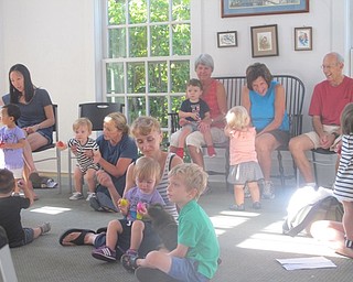 Neighbors | Zack Shively.Babies shook their shakers along with a song-on-tape featuring multiple nursery rhymes at the Poland library on Sept. 27.