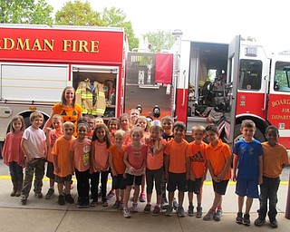 Neighbors | Zack Shively.Tamara Socie's kindergarten class stood in front of the the fire truck after learning about the different equipment on it on Oct. 4.