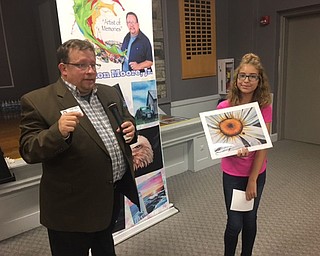 Neighbors | Submitted .Artist Ron Moore Jr. is pictured with student Madison Harding, holding “Petals of Hope” for hurricane relief.