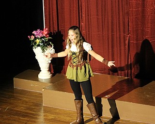 Neighbors | Abby Slanker.On Oct. 19, Malia Swartz performed a scene as Puck from “A Midsummer Night’s Dream.” Canfield Village Middle School’s fifth- and sixth-grade Drama Club’s members performed as part of their Supper with Shakespeare event.