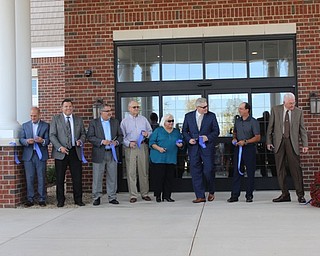 Neighbors | Abby Slanker.Local dignitaries joined John Masternick, president of Windsor House, (third from right) in cutting the ribbon at the grand opening of Windsor House at Canfield on Oct. 22.