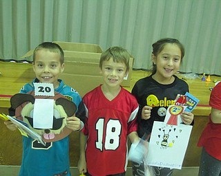 Neighbors | Zack Shively.The members of Let's Make a Difference handed out awards for an Emoji Contest sponsored by Barnes and Noble. The Poland Union Elementary second-grade students drew an emoji and parents and grandparents voted on the best ones. Pictured are third place winner Codi Collins, first place winner Dominic Volpini and third place winner Giada DeSantis.