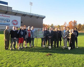 Neighbors | Zack Shively.The athletic complex project at Austintown schools will give the school a turf baseball field, the first turf baseball field in the Mahoning Valley. Pictured, the high school baseball team stood with the group that broke ground on the athletic complex.
