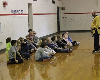 Neighbors | Abby Slanker.Master Justin Taylor Jr., owner of Junior Tae Kwon Do School, talked to a class of fourth-graders about bullying prevention during a visit to the school on Nov. 7.