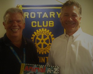 Alex Benyo, part owner of Brilex Group, spoke to Austintown Rotarians about the challenges and successes of local start-up businesses and the specialties he brings to the marketplace. Founded in 1996, the business has expanded to provide a complex range of services to the steel industry and a broader range of products. Benyo, a Fitch graduate, stressed the importance of finding a dependable and patient work force to grow with the company and strive for customer satisfaction and service. Above, from left, are Bruce Laraway, Austintown Rotary president, presenting a library book to Benyo. The book will be placed in the Austintown Elementary School library in his honor.