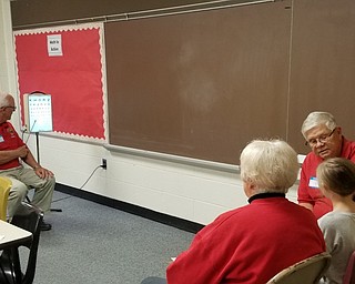 Canfield Lions recently conducted vision screenings at Hilltop Elementary School for first- through third-graders and all new students to the school district. Lions helping that day were John Africa, Pat Murphy, Chuck Tieche, Marian Zickefoose, Dr. Carmela Abraham, Cathy Price, Don Peterson and Suzanne DePinto. Above, second-grader Ava Lombardo is checked by Africa at the eye chart while Lions Murphy and Tieche assist Ava.