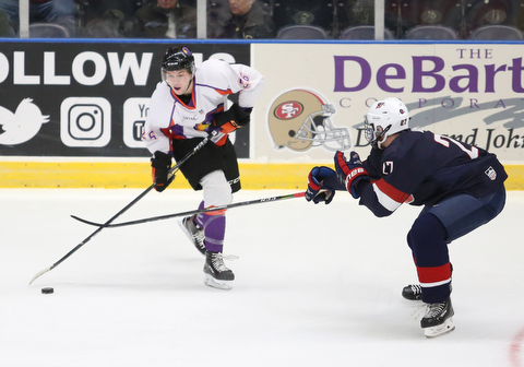 Youngstown Phantoms forward Matthew Barry (26) passes before Team USA defenseman DJ King (27) can steal during the first period as Team USA takes on the Youngstown Phantoms, Friday, Nov. 17, 2017, at the Covelli Centre in Youngstown...(Nikos Frazier | The Vindicator)..
