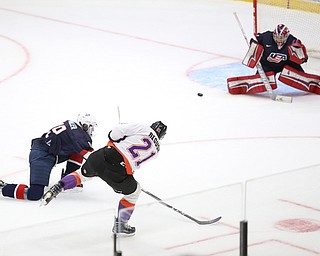 Youngstown Phantoms center Mike Regush (21) shoots towards the goal during the first period as Team USA takes on the Youngstown Phantoms, Friday, Nov. 17, 2017, at the Covelli Centre in Youngstown...(Nikos Frazier | The Vindicator)..