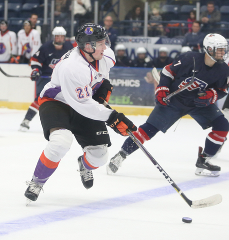 Youngstown Phantoms center Mike Regush (21) charges towards the net during the first period as Team USA takes on the Youngstown Phantoms, Friday, Nov. 17, 2017, at the Covelli Centre in Youngstown...(Nikos Frazier | The Vindicator)..