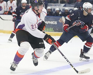 Youngstown Phantoms center Mike Regush (21) charges towards the net during the first period as Team USA takes on the Youngstown Phantoms, Friday, Nov. 17, 2017, at the Covelli Centre in Youngstown...(Nikos Frazier | The Vindicator)..