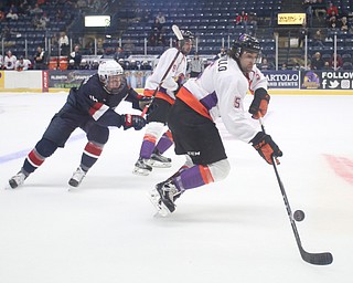 Youngstown Phantoms defenseman Andrew Petrillo (5)  recovers an airborn puck during the first period as Team USA takes on the Youngstown Phantoms, Friday, Nov. 17, 2017, at the Covelli Centre in Youngstown...(Nikos Frazier | The Vindicator)..