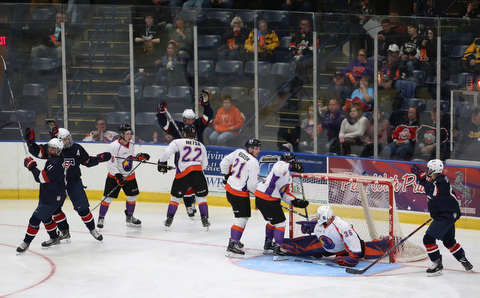 Team USA celebrates a goal on Youngstown Phantoms goalie Wouter Peeters (36) during the second period as Team USA takes on the Youngstown Phantoms, Friday, Nov. 17, 2017, at the Covelli Centre in Youngstown...(Nikos Frazier | The Vindicator)..