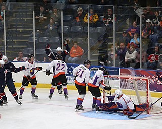 Team USA celebrates a goal on Youngstown Phantoms goalie Wouter Peeters (36) during the second period as Team USA takes on the Youngstown Phantoms, Friday, Nov. 17, 2017, at the Covelli Centre in Youngstown...(Nikos Frazier | The Vindicator)..