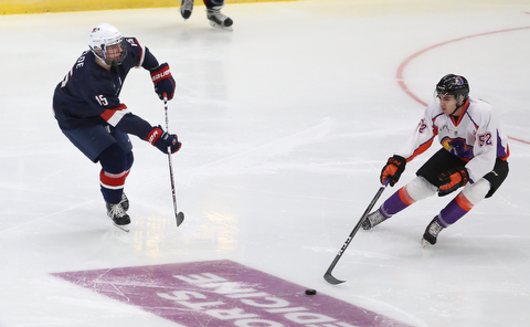 Youngstown Phantoms center Craig Needham (52) goes to steal the puck from Team USA defenseman Bode Wilde (15) during the second period as Team USA takes on the Youngstown Phantoms, Friday, Nov. 17, 2017, at the Covelli Centre in Youngstown...(Nikos Frazier | The Vindicator)..