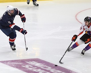 Youngstown Phantoms center Craig Needham (52) goes to steal the puck from Team USA defenseman Bode Wilde (15) during the second period as Team USA takes on the Youngstown Phantoms, Friday, Nov. 17, 2017, at the Covelli Centre in Youngstown...(Nikos Frazier | The Vindicator)..