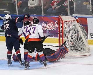 Team USA forward Oliver Wahlstrom (18) takes the puck and net away for a goalduring the second period as Team USA takes on the Youngstown Phantoms, Friday, Nov. 17, 2017, at the Covelli Centre in Youngstown...(Nikos Frazier | The Vindicator)..