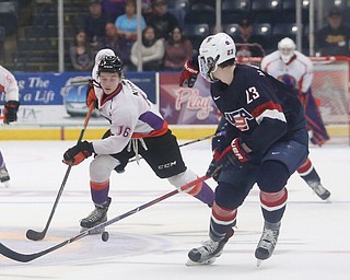 Youngstown Phantoms center Trevor Kuntar (16) skates against Team USA defenseman Mattias Samuelsson (23) during the second period as Team USA takes on the Youngstown Phantoms, Friday, Nov. 17, 2017, at the Covelli Centre in Youngstown...(Nikos Frazier | The Vindicator)..