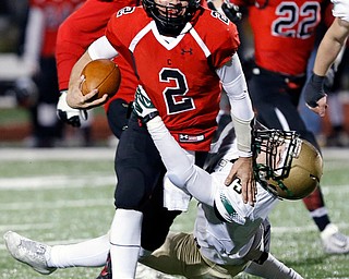 SALEM, OHIO - NOVEMBER 17, 2017:  Canfield's Vinny Fiorenza (2) stiff arms SVSM's Scott Walter(5) during the 2nd qtr. at Reilly Stadium, Salem High School.  MICHAEL G TAYLOR | THE VINDICATOR