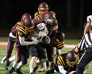 Black River's Riley Rivers (11) gets stood up by a host of Raider defenders during the first half of Friday nights matchup at Canal Fulton.  Dustin Livesay  |  The Vindicator  11/17/17  Canal Fulton.