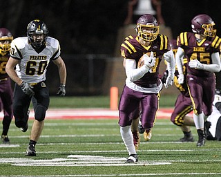 Aniello Buzzacco (14) returns a fumble for a touchdown, outrunning Black River's Cole Haswell (60) during the first half of Friday nights matchup against at Canal Fulton.  Dustin Livesay  |  The Vindicator  11/17/17  Canal Fulton.