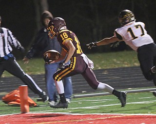 Mathias Combs (18) of South Range reaches for the endzone outrunning Black Rivers .Brandon Weidrick (17) during the fourth quarter of Friday nights matchup in Canal Fulton .  Dustin Livesay  |  The Vindicator  11/17/17  Canal Fulton