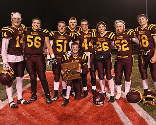 South Range seniors pose for a picture with the Regional championship trophy after defeating Black River 40-16 on Friday night.  Dustin Livesay  |  The Vindicator  11/17/17  Canal Fulton