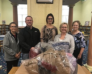Columbiana Rotary Club recently delivered coats to Joshua Dixon Elementary School as part of the Operation Warm project. Mitch McGuckin, a Realtor with Century 21 Lakeside Realty, joined in the project by supplying matching hats and gloves to be paired with each coat. The Rotary funds the project in part from the flag project of Columbiana. For information about the flag project, call April Brinker, Rotary Club treasurer, at 330-482-3822. Pictured, from left, are Rose Newbold, Columbiana Rotary; McGuckin; Marcie Freedy, Joshua Dixon assistant principal; Brinker; and Carol Cobbs, Columbiana Rotary.