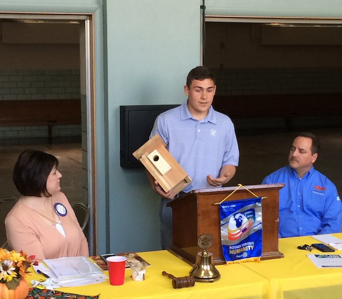 Struthers High School student Nick Locke discussed the results of his Eagle Scout project at a recent meeting of the Struthers Rotary Club. Locke’s project was funded by the Rotary and consisted of building birdhouses for bluebirds to replace those used by the Mill Creek MetroParks system. Locke’s birdhouses were specifically designed to attract Eastern Bluebirds and were made using cedar to extend their longevity. They are used at the McGuffey Wildlife Preserve. More details about the birdhouses may be found at www.millcreekmetroparks.org/visit/wildlife-viewing/. Above, center, Locke shows one of the 25 birdhouses he constructed. From left are Jennifer Johnson, Rotary president and Rotarian Bryan Higgins.