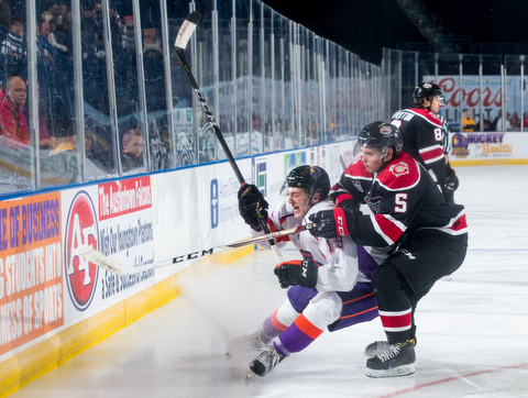 Scott R. Galvin | The Vindicator.Youngstown Phantoms right wing Chase Gresock (19) skates around Chicago Steel center Brett Budgell (5) as he chases the puck during the first period at the Covelli Centre on Saturday, November 18, 2017.