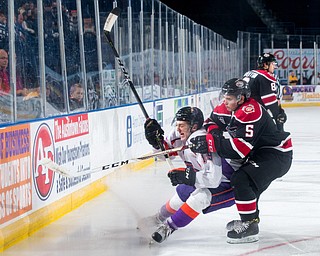 Scott R. Galvin | The Vindicator.Youngstown Phantoms right wing Chase Gresock (19) skates around Chicago Steel center Brett Budgell (5) as he chases the puck during the first period at the Covelli Centre on Saturday, November 18, 2017.