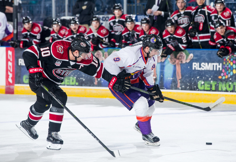 Scott R. Galvin | The Vindicator.Youngstown Phantoms left wing Tommy Parrottino (9) skates to the net past Chicago Steel defenseman Derek Daschle (10) during the first period at the Covelli Centre on Saturday, November 18, 2017.