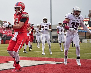 YOUNGSTOWN, OHIO - NOVEMBER 18, 2017: Youngstown State's Ricky Davis smiles after scoring a touchdown beating Missouri State's Kurran Blamey to the end zone during the second half of Saturday afternoons game at Stambaugh Stadium. Youngstown State won 38-10. DAVID DERMER | THE VINDICATOR