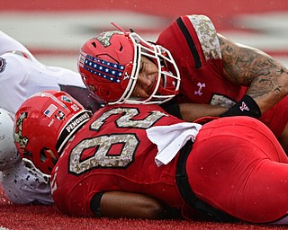 YOUNGSTOWN, OHIO - NOVEMBER 18, 2017: Youngstown State's Billy Nicoe Hurst, right, and Samuel St. Surin fall on the football in the end zone for a touchdown after a high snap on a Missouri State punt during the first half of Saturday afternoons game at Stambaugh Stadium. Youngstown State won 38-10. DAVID DERMER | THE VINDICATOR..Missouri State's Chris Cacciarelli pictured.