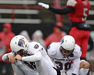 YOUNGSTOWN, OHIO - NOVEMBER 18, 2017: Missouri State kicker Zach Drake, left, reacts after missing a field goal during the first half of Saturday afternoons game at Stambaugh Stadium. Youngstown State won 38-10. DAVID DERMER | THE VINDICATOR..Missouri State's Jared Beshore and Youngstown State's Lee Wright pictured.
