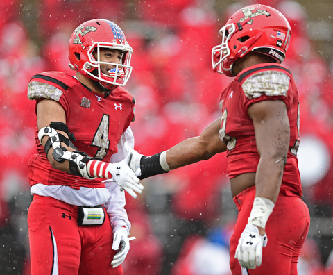 YOUNGSTOWN, OHIO - NOVEMBER 18, 2017: Youngstown State's Justus Reed, left, and Fazson Chapman celebrate after a defensive stop during the first half of Saturday afternoons game at Stambaugh Stadium. Youngstown State won 38-10. DAVID DERMER | THE VINDICATOR