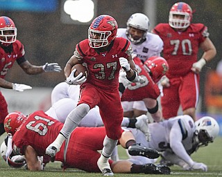 YOUNGSTOWN, OHIO - NOVEMBER 18, 2017: Youngstown State's Tevin McCaster runs in the open field before running into the end zone to score a touchdown during the second half of Saturday afternoons game at Stambaugh Stadium. Youngstown State won 38-10. DAVID DERMER | THE VINDICATOR