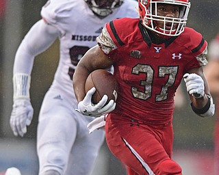 YOUNGSTOWN, OHIO - NOVEMBER 18, 2017: Youngstown State's Tevin McCaster runs in the open field before running into the end zone to score a touchdown during the second half of Saturday afternoons game at Stambaugh Stadium. Youngstown State won 38-10. DAVID DERMER | THE VINDICATOR