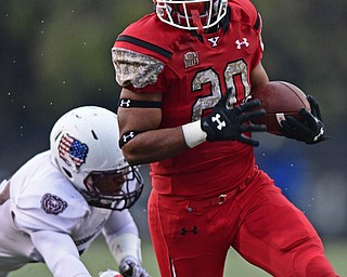YOUNGSTOWN, OHIO - NOVEMBER 18, 2017: Youngstown State's Christian Turner is tripped up by Missouri State's Cam Carter during the second half of Saturday afternoons game at Stambaugh Stadium. Youngstown State won 38-10. DAVID DERMER | THE VINDICATOR