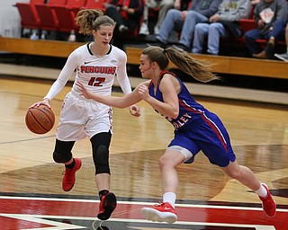 Youngstown State guard Chelsea Olson (12) drives towards the net as Ohio Valley guard JordanÊFox (20) tries to steal the ball during the first quarter as Ohio Valley University takes on Youngstown State University in a NCAA basketball game, Monday, Nov. 20, 2017, at the Beeghly Center in Youngstown. YSU won 86-59...(Nikos Frazier | The Vindicator)..
