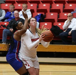 Youngstown State forward Mary Dunn (15) goes up for two as Ohio Valley forward ArielÊJohnson (22) tries to swat the ball away during the first quarter as Ohio Valley University takes on Youngstown State University in a NCAA basketball game, Monday, Nov. 20, 2017, at the Beeghly Center in Youngstown. YSU won 86-59...(Nikos Frazier | The Vindicator)..