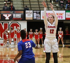 Youngstown State guard Chelsea Olson (12) goes up for three as Ohio Valley guard AyannaÊFord (23) watches on during the first quarter as Ohio Valley University takes on Youngstown State University in a NCAA basketball game, Monday, Nov. 20, 2017, at the Beeghly Center in Youngstown. YSU won 86-59...(Nikos Frazier | The Vindicator)..