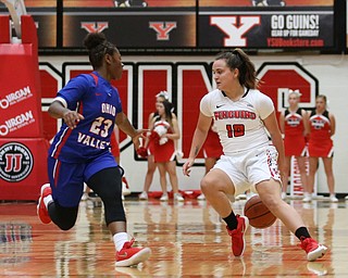 Youngstown State guard Josie Fisher (10) crosses the ball behind her back to evade Ohio Valley guard AyannaÊFord (23) during the second quarter as Ohio Valley University takes on Youngstown State University in a NCAA basketball game, Monday, Nov. 20, 2017, at the Beeghly Center in Youngstown. YSU won 86-59...(Nikos Frazier | The Vindicator)..