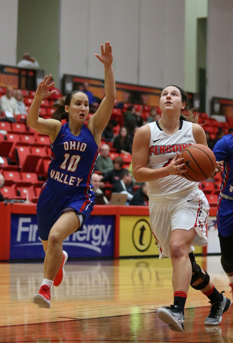 Youngstown State guard Nikki Arbanas (4) goes up for a layup as Ohio Valley guard TannerÊEsposito (10) approaches behind during the third quarter as Ohio Valley University takes on Youngstown State University in a NCAA basketball game, Monday, Nov. 20, 2017, at the Beeghly Center in Youngstown. YSU won 86-59...(Nikos Frazier | The Vindicator)..