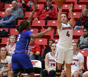 Youngstown State guard Nikki Arbanas (4) goes up for three as Ohio Valley guard JazzmynÊSimmons (2) tries to block her shot during the third quarter as Ohio Valley University takes on Youngstown State University in a NCAA basketball game, Monday, Nov. 20, 2017, at the Beeghly Center in Youngstown. YSU won 86-59...(Nikos Frazier | The Vindicator)..