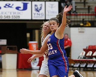 Youngstown State guard Nikki Arbanas (4) passes the ball as Ohio Valley guard HaleyÊAckerman (33) collides with her during the fourth quarter as Ohio Valley University takes on Youngstown State University in a NCAA basketball game, Monday, Nov. 20, 2017, at the Beeghly Center in Youngstown. YSU won 86-59...(Nikos Frazier | The Vindicator)..