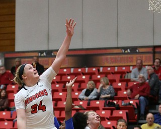 Youngstown State guard McKenah Peters (34) goes up for a layup as she collides with Ohio Valley guard AmiayaÊMelvins (1) and Youngstown State forward Natalie Myers (24) during the fourth quarter as Ohio Valley University takes on Youngstown State University in a NCAA basketball game, Monday, Nov. 20, 2017, at the Beeghly Center in Youngstown. YSU won 86-59...(Nikos Frazier | The Vindicator)..