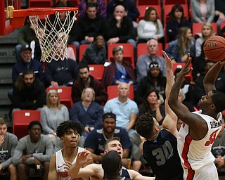Youngstown State forward Naz Bohannon (33) goes up for two over Westminister College guard MarcoÊDelorenzo (30) during the first half as Westminister College takes on Youngstown State in a NCAA basketball game, Tuesday, Nov. 21, 2017, at the Beeghly Center in Youngstown. YSU won 91-83...(Nikos Frazier | The Vindicator)..