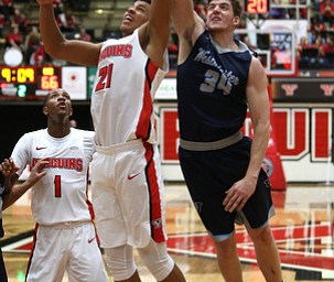 Youngstown State forward Noe Anabir (21) goes up to the net as Westminister College center BlakeÊPayne (34) blocks the shot during the second half as Westminister College takes on Youngstown State in a NCAA basketball game, Tuesday, Nov. 21, 2017, at the Beeghly Center in Youngstown. YSU won 91-83...(Nikos Frazier | The Vindicator)..